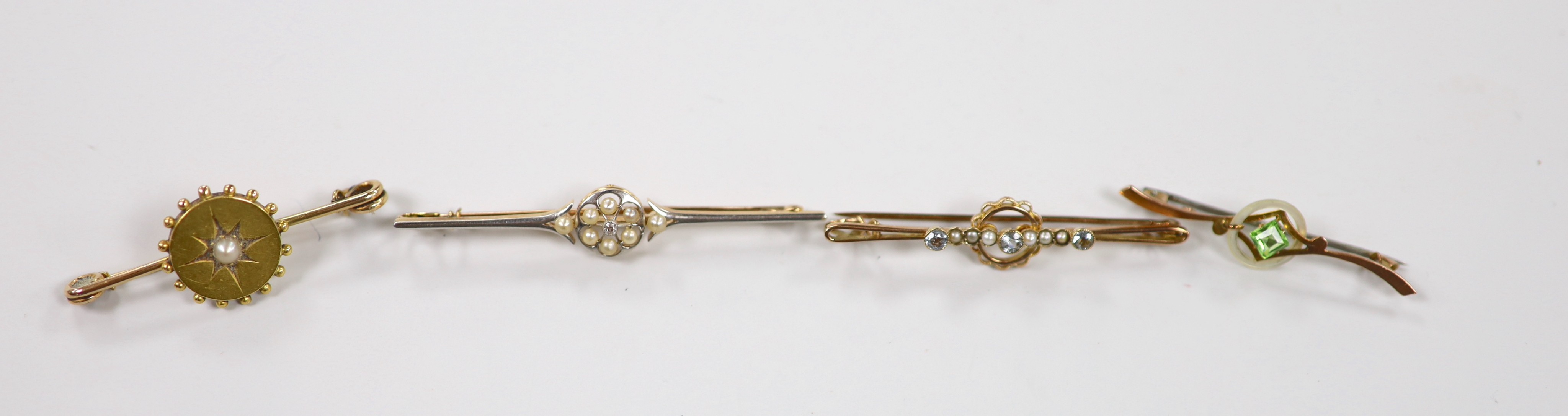 A Victorian 15ct, diamond and seed pearl cluster set bar brooch, 59mm, gross 4 grams and three other early 20th century gem set bar brooches including two 9ct, gross weight 8.7 grams.
